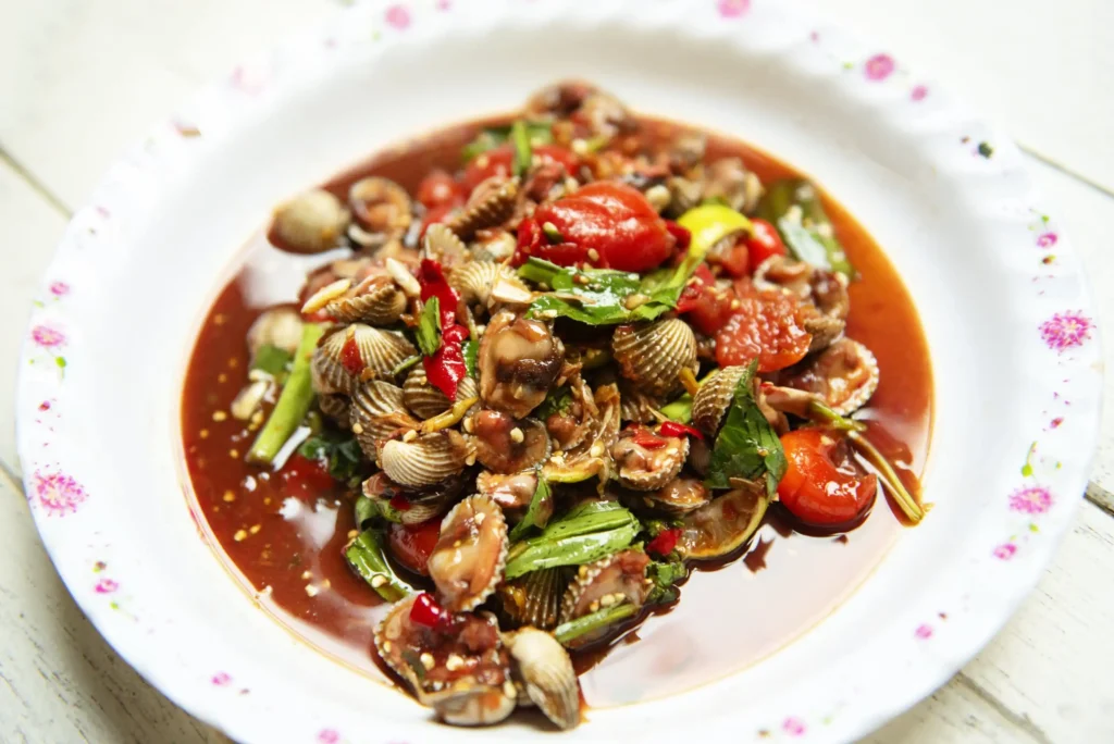 Papaya Salad with Cockles (Tam Hoy Kraeng) 1 hot-spicy-shellfish-blood-cockles-salad-mix-vegetable-tomato-herb-spices-thai-style-food (Web H)