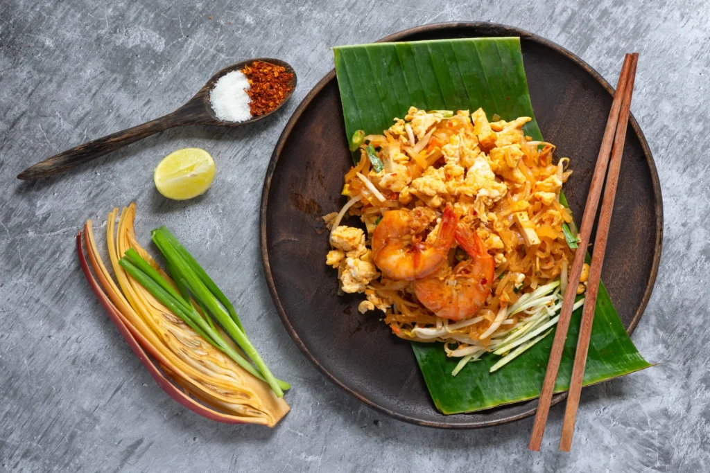 Thai-Style Fried Noodles (Phad Thai) 1 pad-thai-noodle-with-shrimps-vegetables-close-up-table (Web H)
