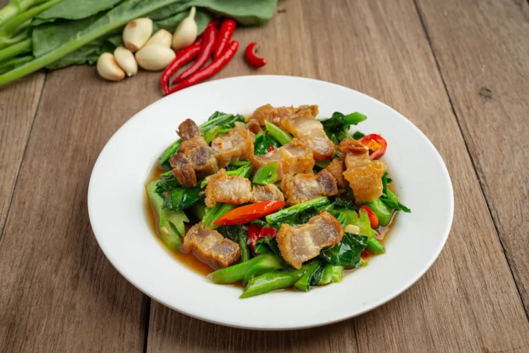 stir-fried-kale-spicy-crispy-pork-wooden-table-thai-food-concept (3) (Web H)
