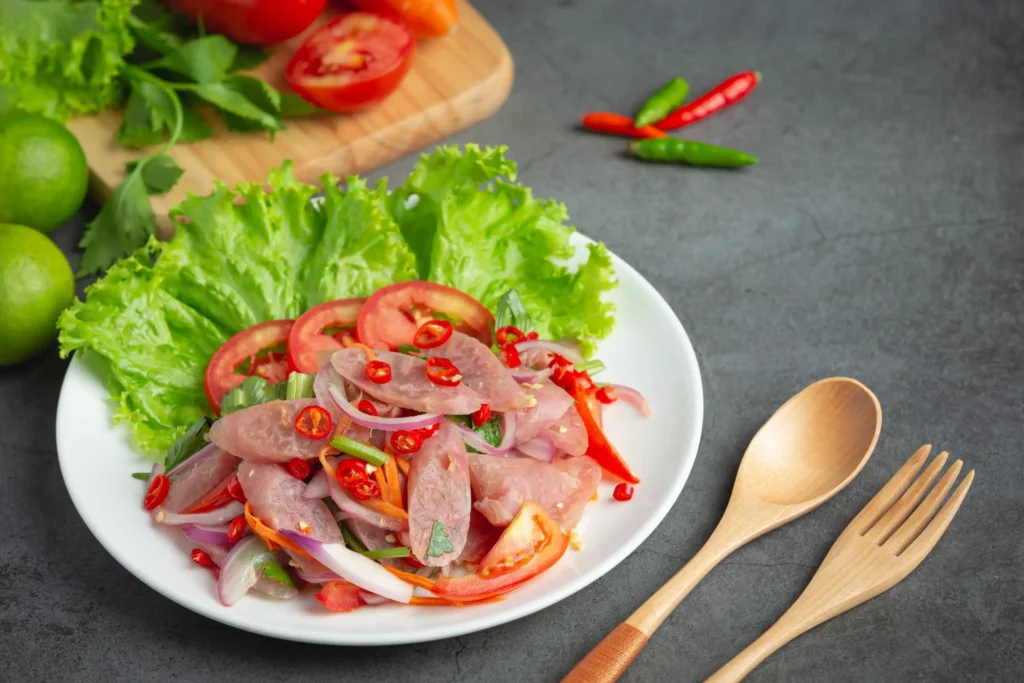 Pig Skin and Sour Pork Salad (Yam Naem Sod) 1 thai-food-mixed-spicy-sour-pork-salad-yum-nam (Web H)